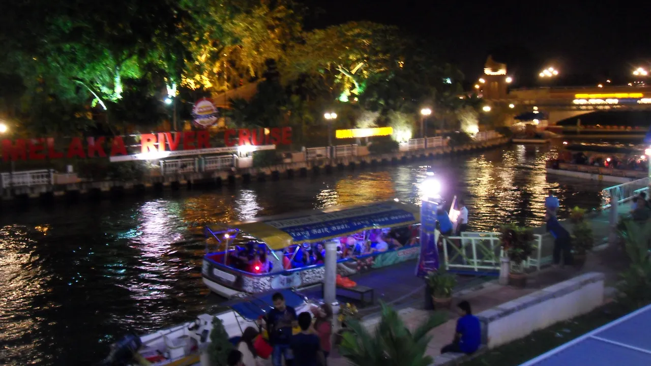 dragon boat on the Melaka River during a festival